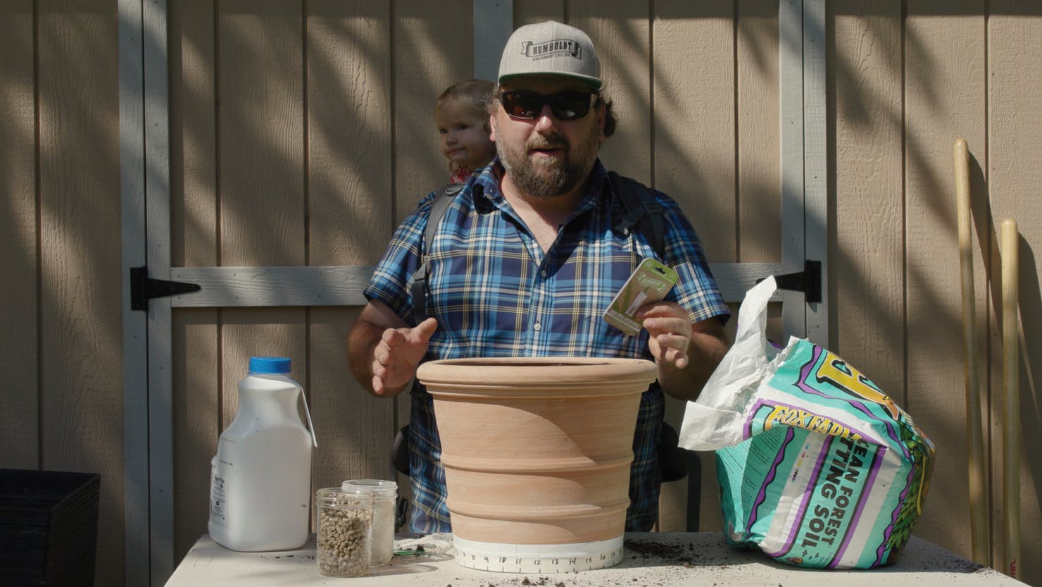 Nat Pennington in front of cannabis pot