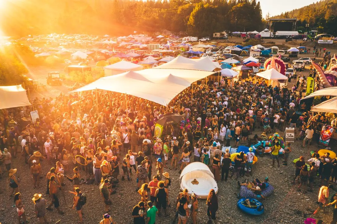 people at cannabis festival with tents