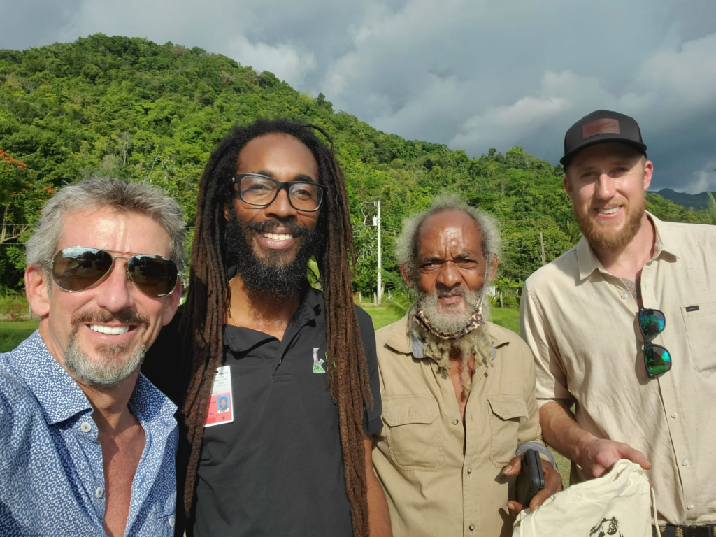 Ben Lind posing with three cannabis growers