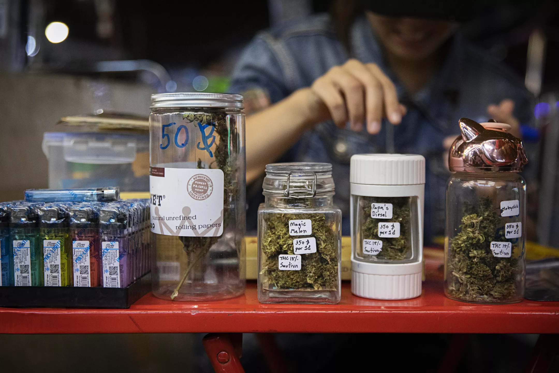 jars of cannabis nugs on table