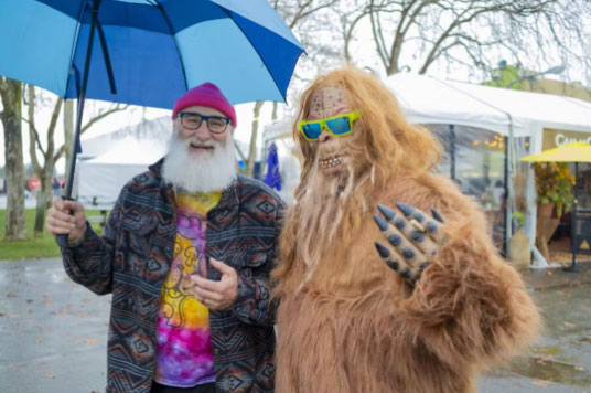 two men posing one in monster costume