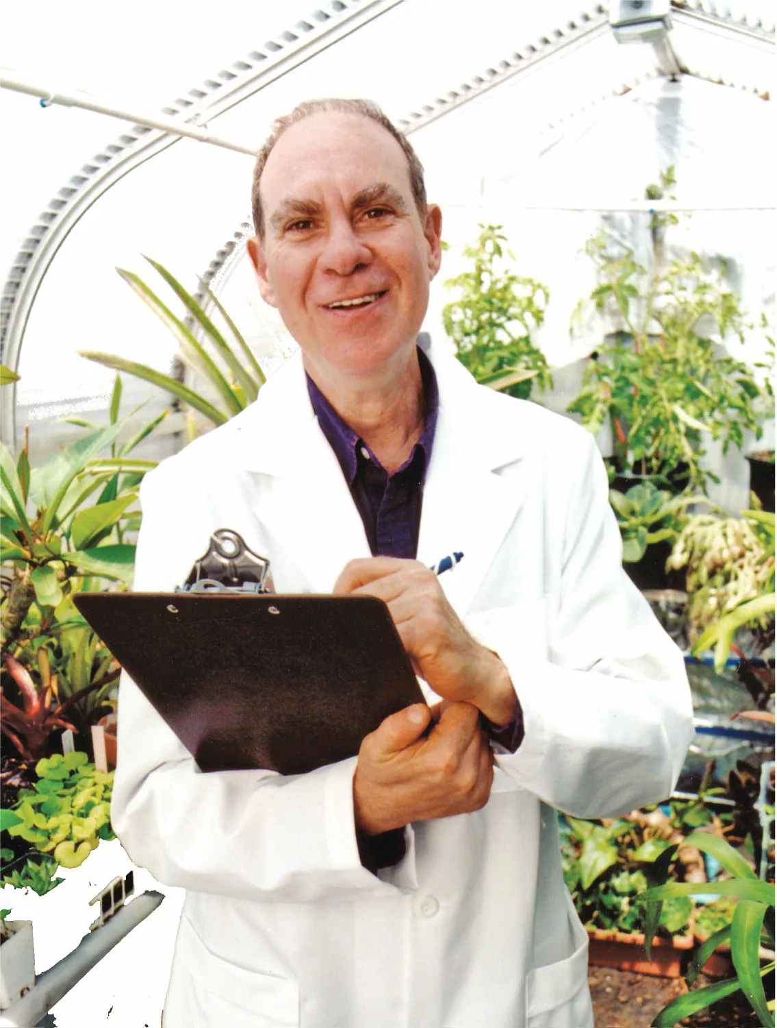Ed Rosenthal in lab coat in cannabis grow room