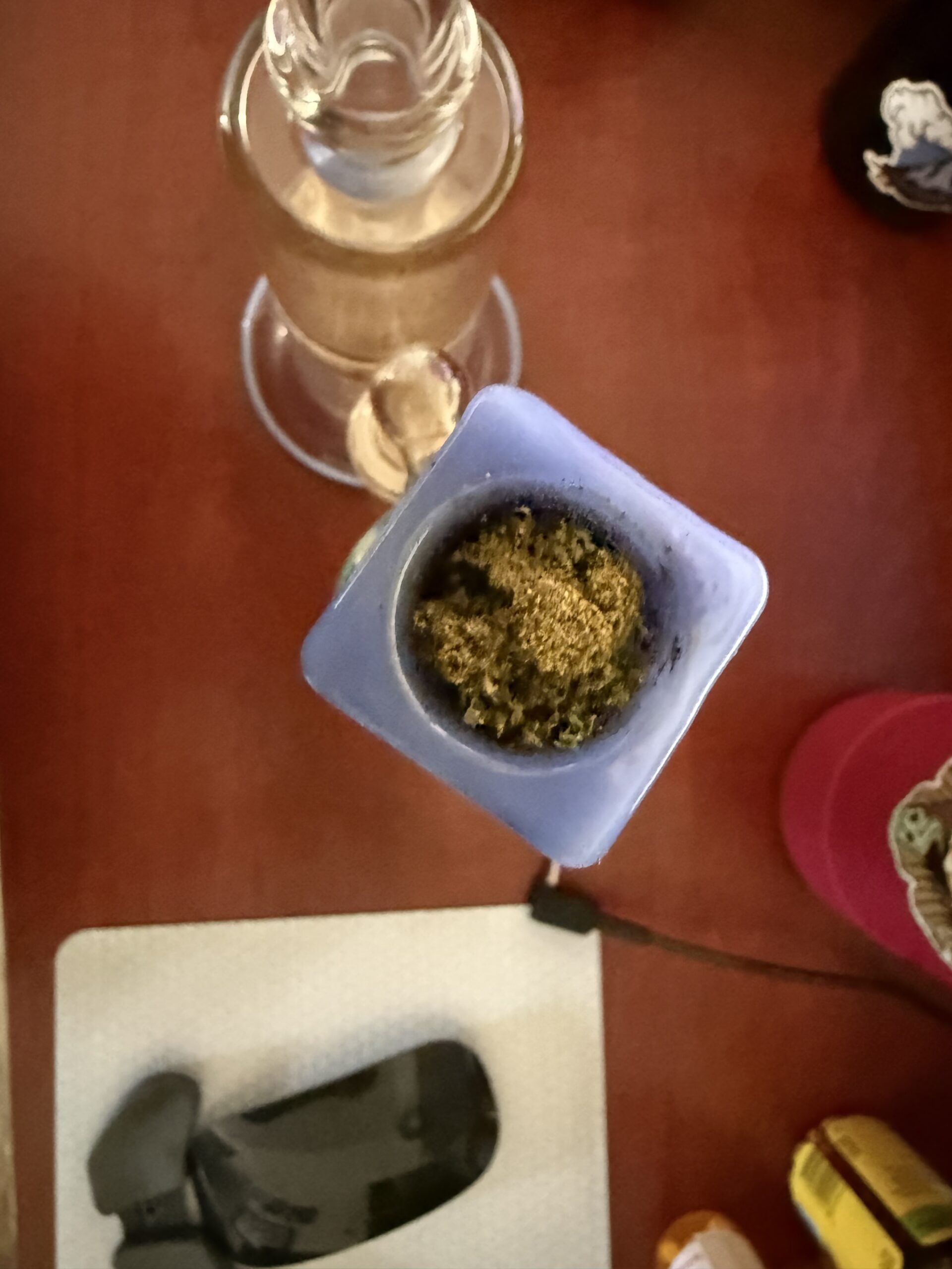 kief crown in bong bowl on a desktop