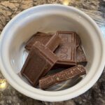 Hershey's chocolate broken pieces in ramekin for melting