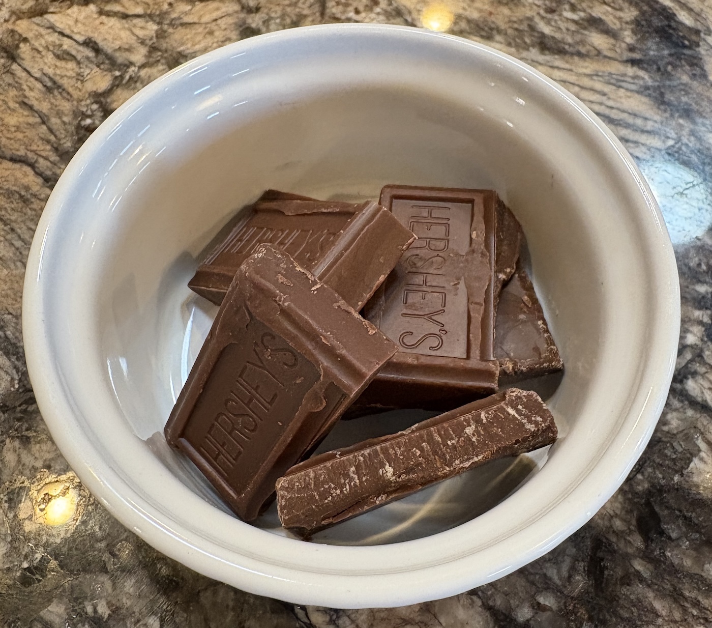Hershey's chocolate broken pieces in ramekin for melting