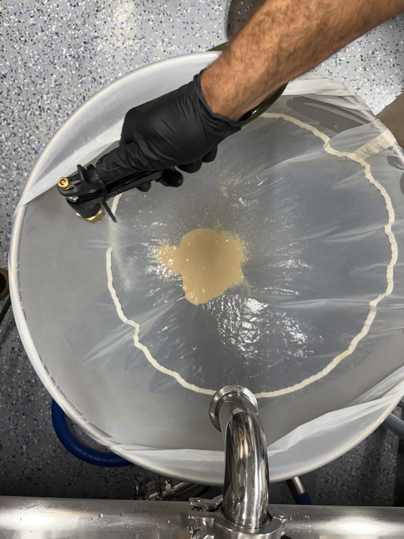 Man washing cannabis to make bubble hash with bags