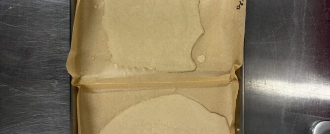 three grades of ice water hash on a tray with parchment paper