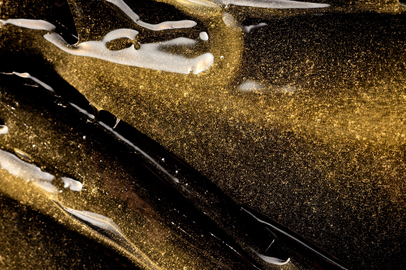 Fresh pressed cannabis rosin under magnification