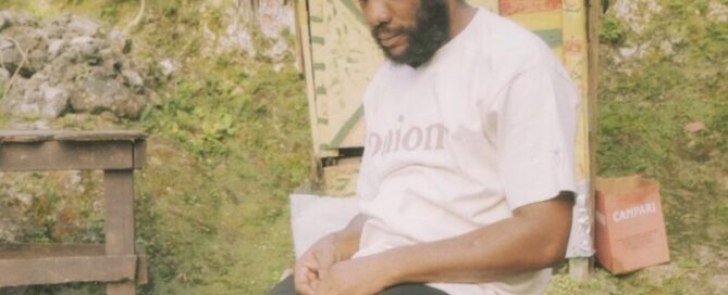 Man wearing brand Carrots Carrots “Onions” Capsule with white shirt and black pants