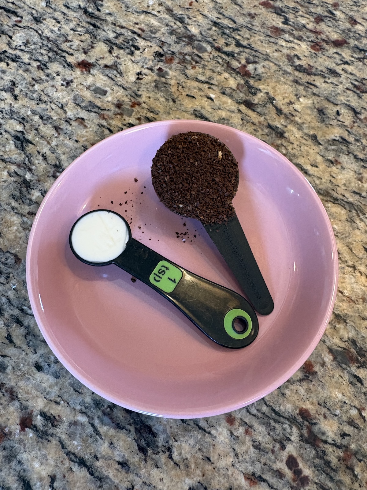 1 tsp cannabis butter and 1 tbs ground coffee on a plate